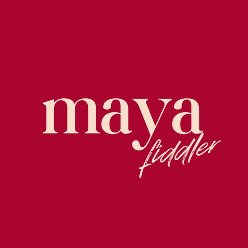 With deep red background the name of the site owner: maya fiddler. It is written with handwriting